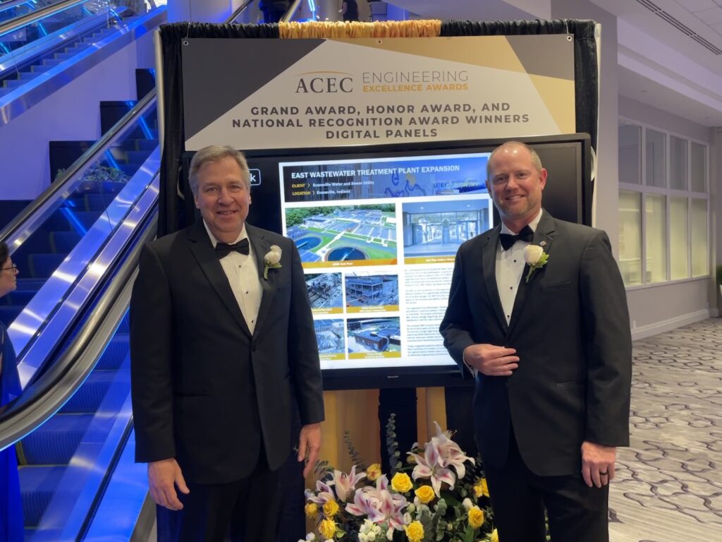 Clark Dietz's Wes Christmas and Jerry Payonk accept ACEC National's Honor Award for the Evansville East Wastewater Treatment Plant Expansion Project