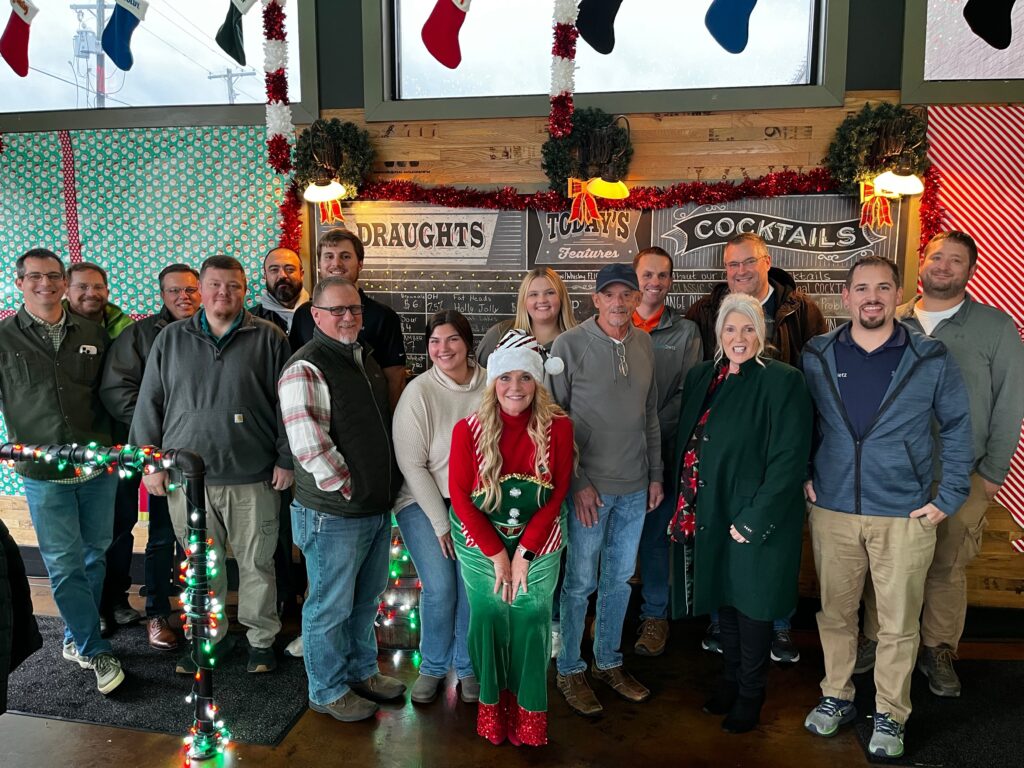 a group of clark dietz employees posing for a photo at Doug Wolf's retirement party